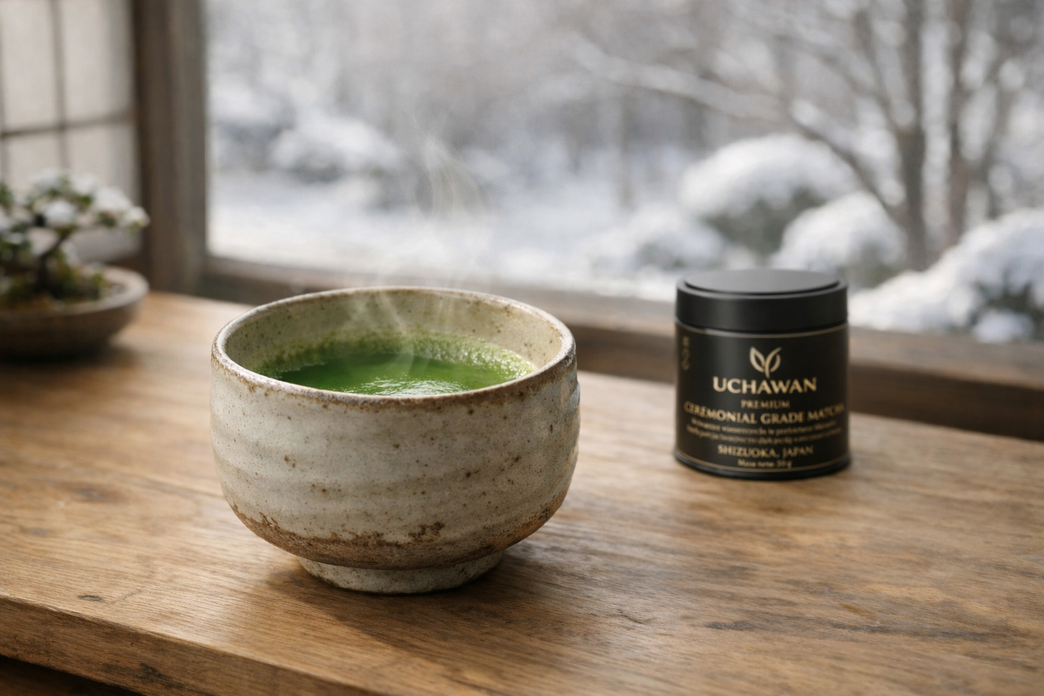 Ceremonial grade matcha in a handcrafted ceramic chawan on a wooden surface, with soft winter daylight and a premium matcha can subtly placed in the background, evoking a calm Japanese tea ritual atmosphere.